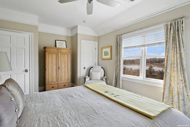 bedroom with vaulted ceiling and ceiling fan