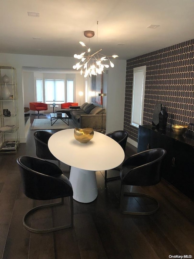 dining space with a notable chandelier