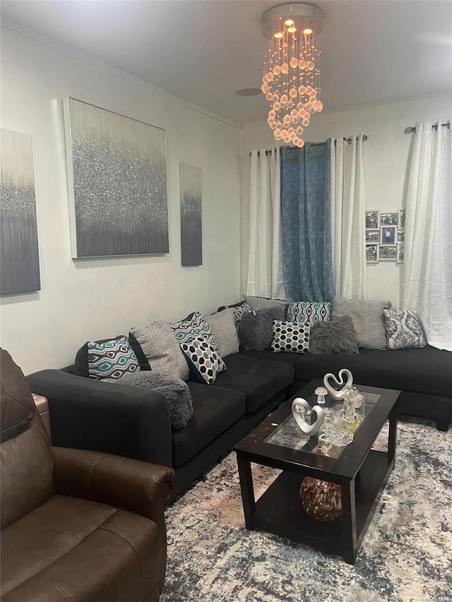 living room featuring ornamental molding and a chandelier