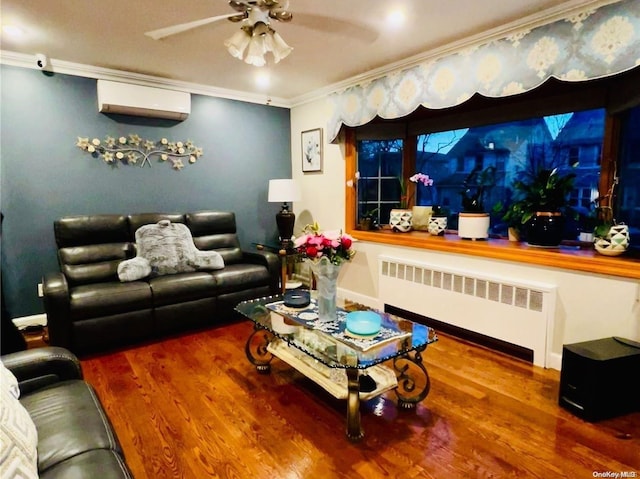 living room featuring wood-type flooring, crown molding, radiator, and an AC wall unit