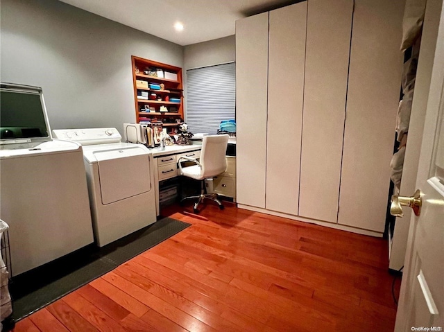 office space featuring dark hardwood / wood-style flooring and independent washer and dryer