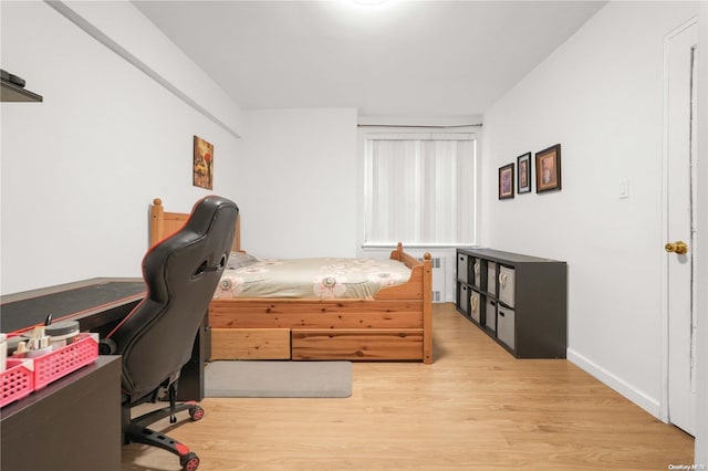 bedroom with light hardwood / wood-style flooring