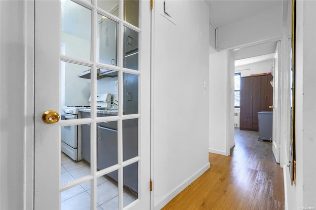 hallway with light wood-type flooring