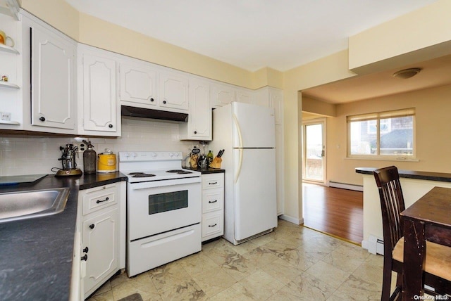 kitchen with backsplash, white cabinetry, white appliances, and a baseboard heating unit