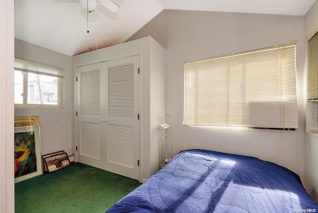 bedroom featuring carpet flooring, ceiling fan, a closet, and lofted ceiling