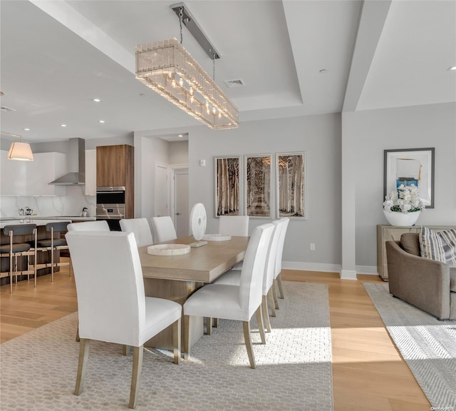 dining area with light hardwood / wood-style flooring