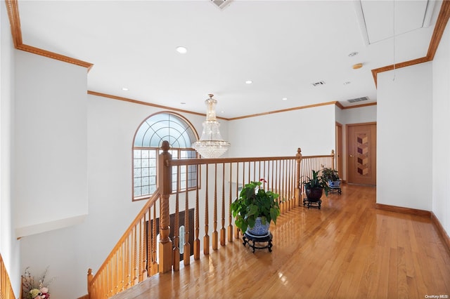 hall featuring crown molding and light wood-type flooring