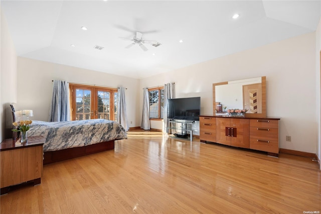 bedroom with ceiling fan, light hardwood / wood-style flooring, and lofted ceiling