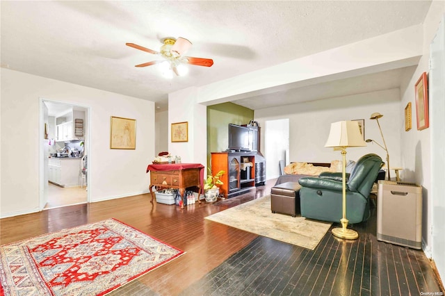 living room featuring hardwood / wood-style flooring and a textured ceiling