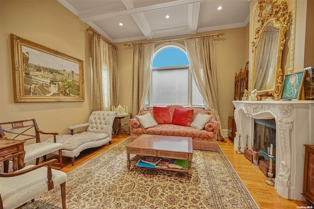 sitting room featuring beam ceiling, crown molding, coffered ceiling, and light wood-type flooring