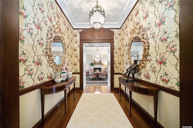 interior space with crown molding, dark hardwood / wood-style floors, and a notable chandelier