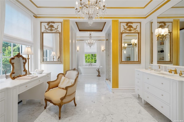 bathroom featuring a bathing tub, plenty of natural light, vanity, and a notable chandelier