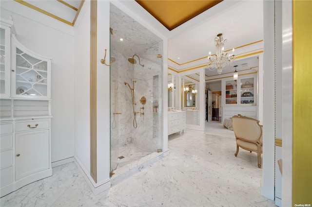 bathroom with vanity, an inviting chandelier, walk in shower, and crown molding