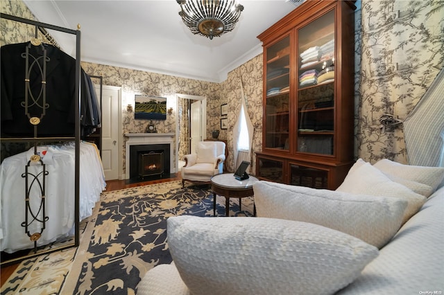 living room with hardwood / wood-style floors and ornamental molding