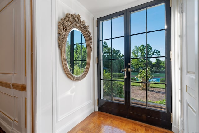 entryway with light parquet floors