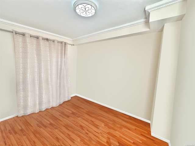 spare room featuring wood-type flooring