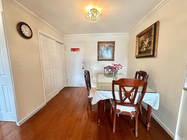 dining area featuring crown molding and wood-type flooring