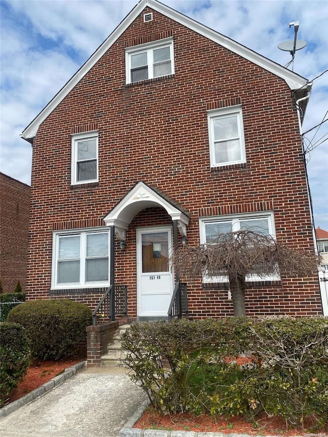 view of front of house with brick siding