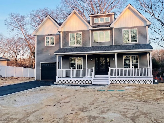 view of front facade with a porch and a garage