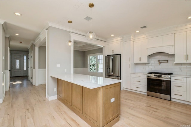 kitchen featuring light stone countertops, kitchen peninsula, stainless steel appliances, light hardwood / wood-style floors, and white cabinetry