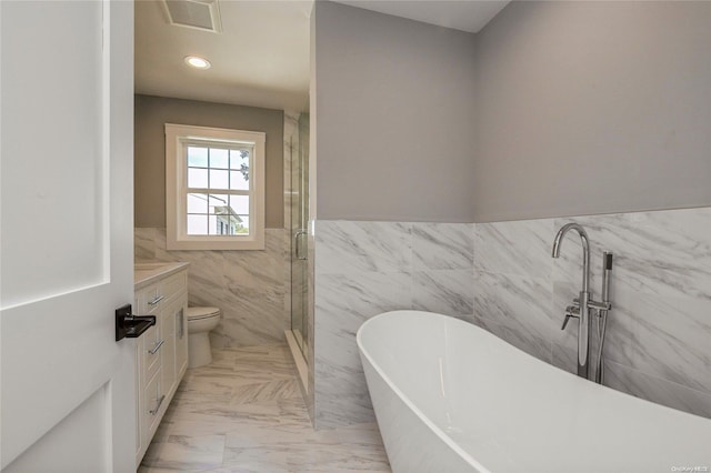 full bathroom featuring vanity, independent shower and bath, tile walls, and toilet