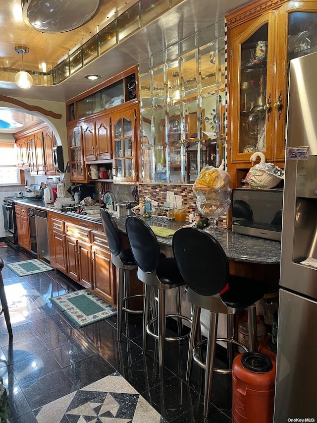 bar featuring stainless steel appliances