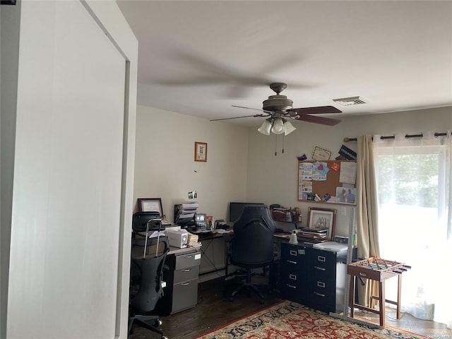 office space featuring dark hardwood / wood-style flooring and ceiling fan