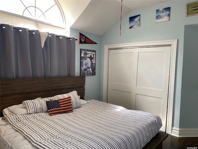 bedroom featuring hardwood / wood-style flooring and lofted ceiling