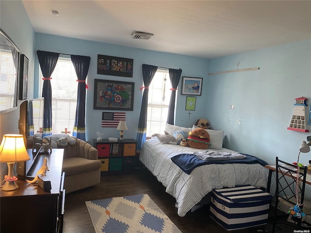 bedroom featuring dark hardwood / wood-style flooring