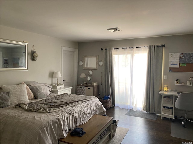 bedroom featuring dark hardwood / wood-style floors