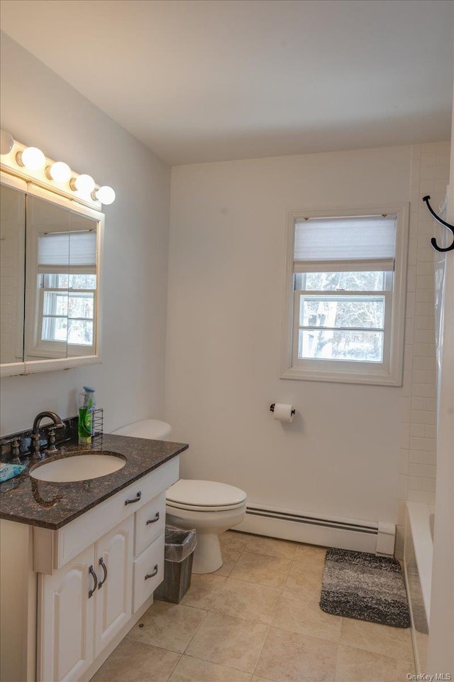 bathroom with vanity, a baseboard radiator, and toilet