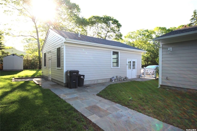 exterior space featuring a yard and a storage shed