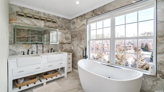 bathroom featuring a bathing tub, vanity, tile walls, and crown molding