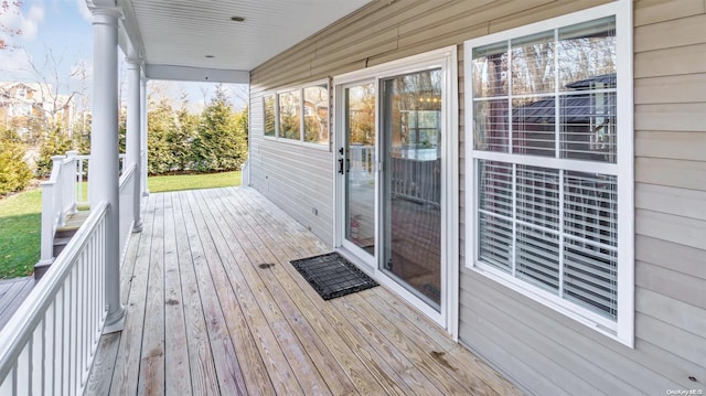 wooden terrace featuring covered porch