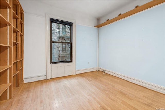 empty room with light wood-type flooring