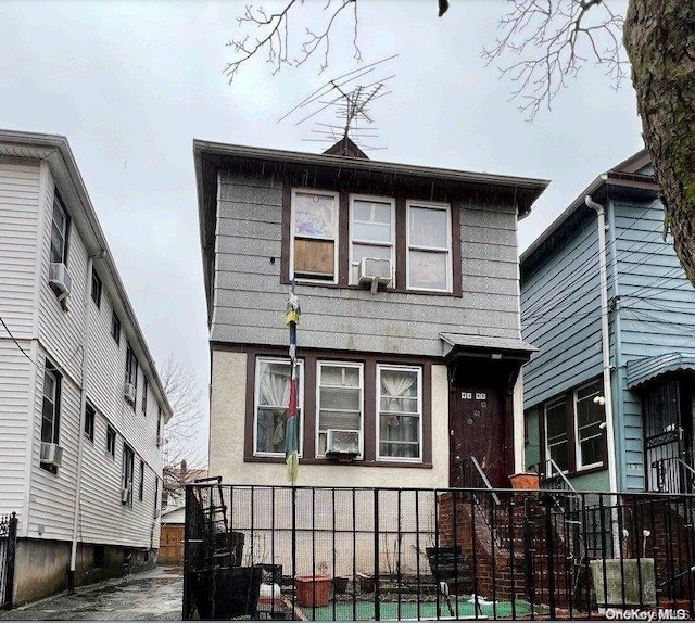 view of front property with cooling unit