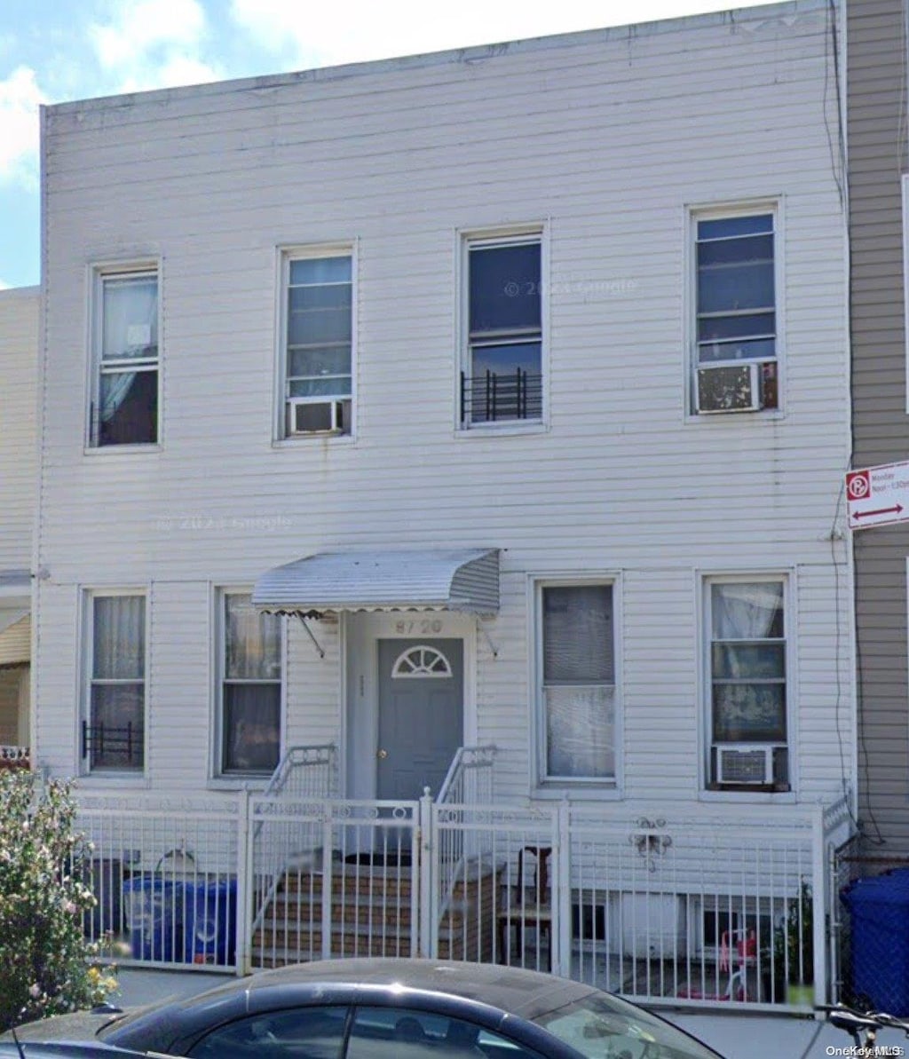 view of front of home with cooling unit