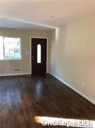 entrance foyer featuring dark hardwood / wood-style floors