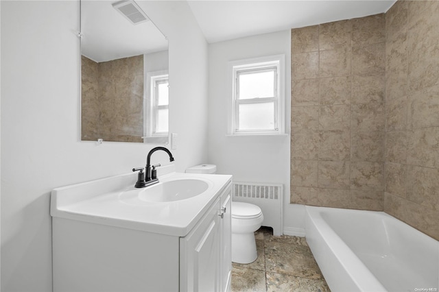 full bathroom featuring vanity, toilet, radiator heating unit, and bathing tub / shower combination