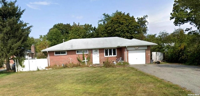 ranch-style house with a garage and a front yard