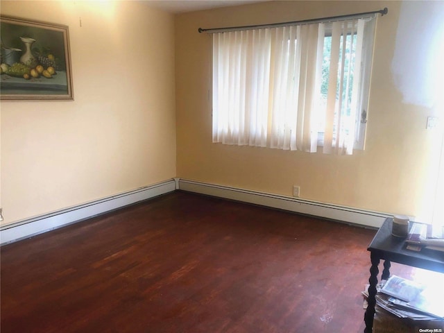 unfurnished room with dark hardwood / wood-style flooring