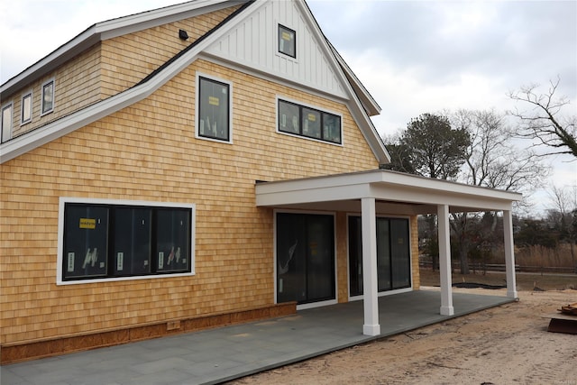 back of property featuring a patio