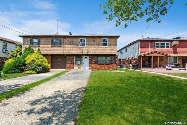 townhome / multi-family property featuring a garage and a front lawn