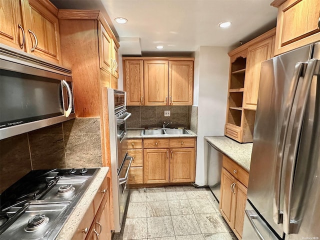 kitchen with backsplash, sink, and stainless steel appliances