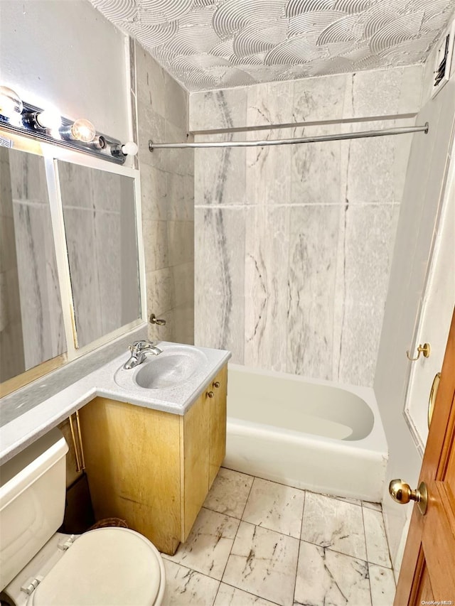 full bathroom with vanity, toilet, and tiled shower / bath