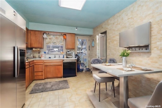 kitchen with stainless steel refrigerator with ice dispenser, backsplash, sink, light tile patterned floors, and black dishwasher