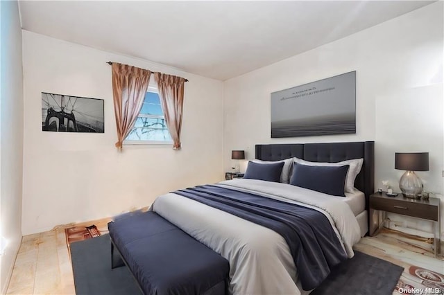 bedroom with light hardwood / wood-style floors