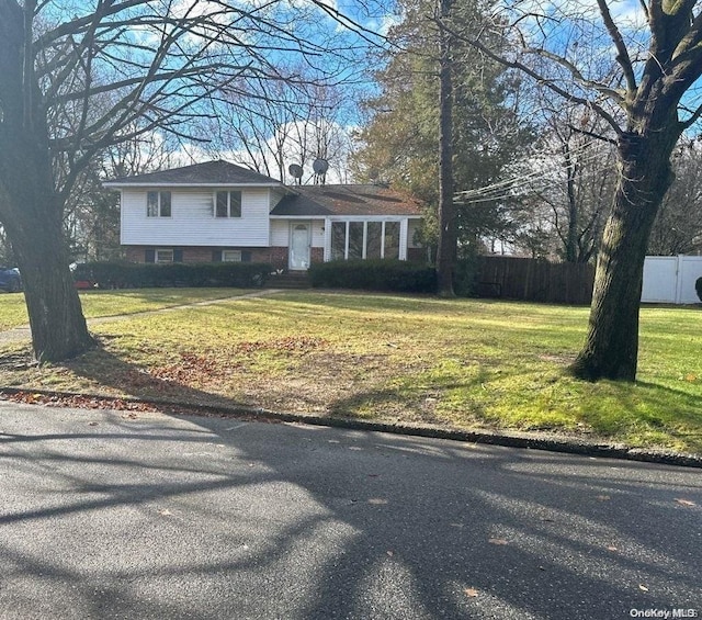 tri-level home featuring a front yard