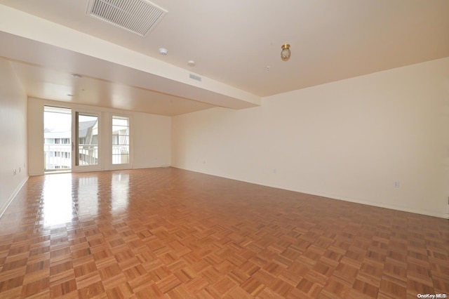 empty room featuring parquet flooring