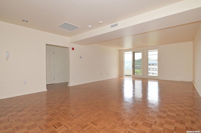 unfurnished room featuring parquet floors